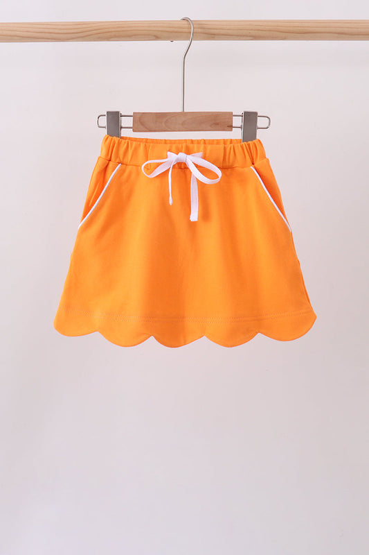 Orange scallop hem bow skort